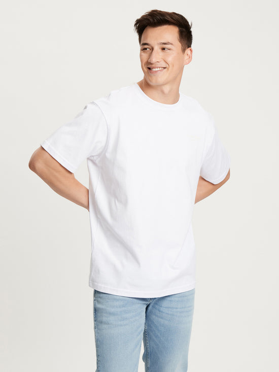 Men's relaxed round neck t-shirt in white.
