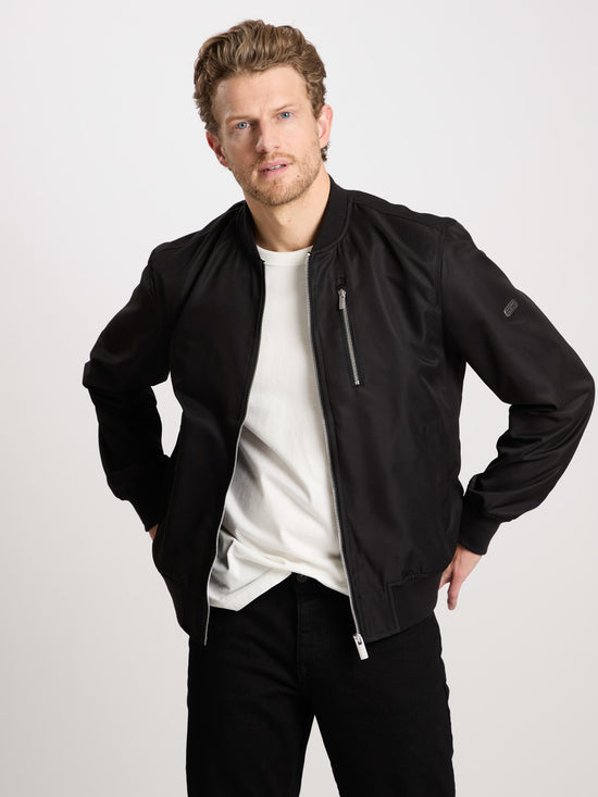 Men's regular bomber jacket with stand-up collar, zip and two pockets, black.