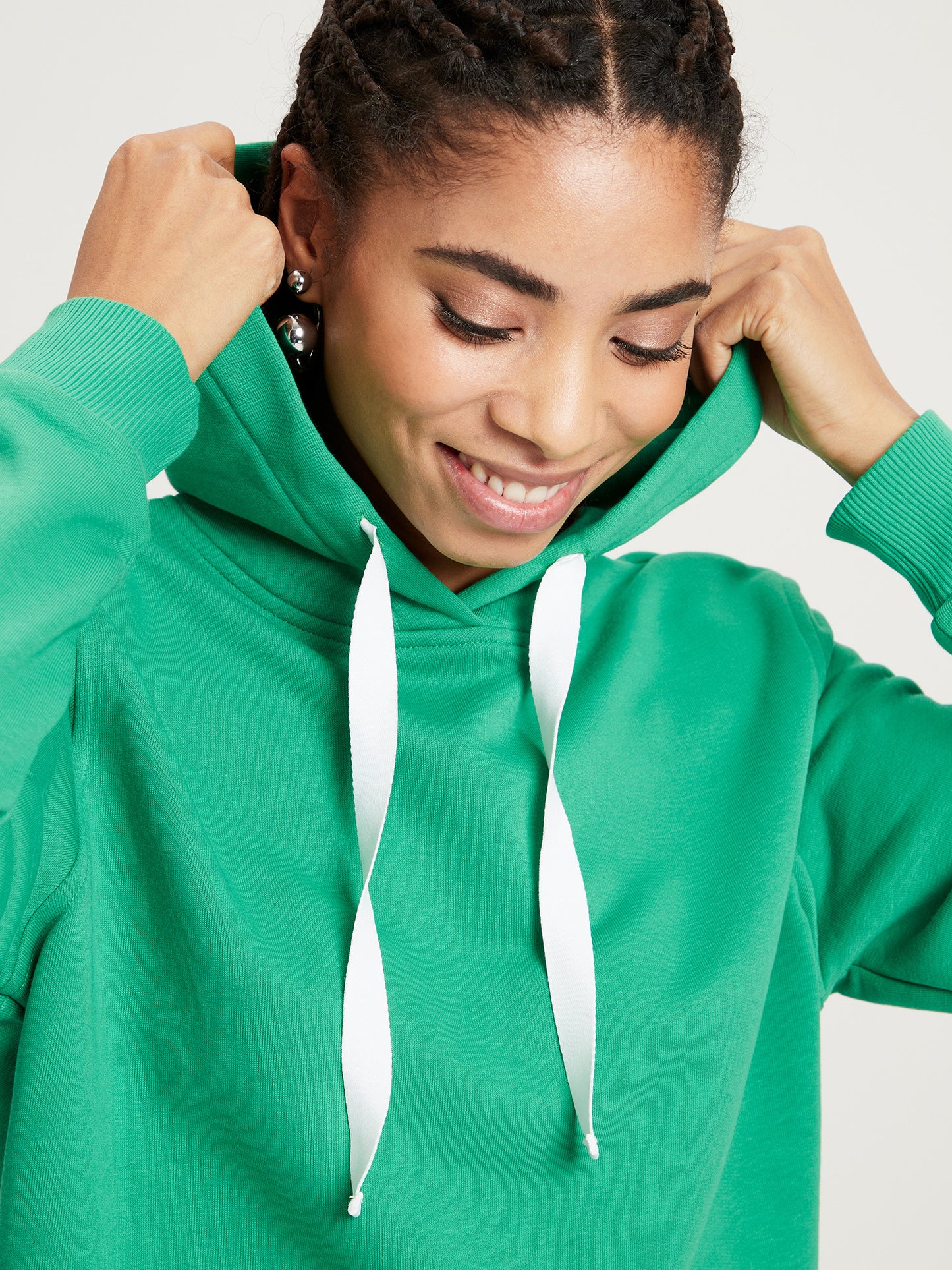 Women's regular hoodie with contrasting tie band in green.