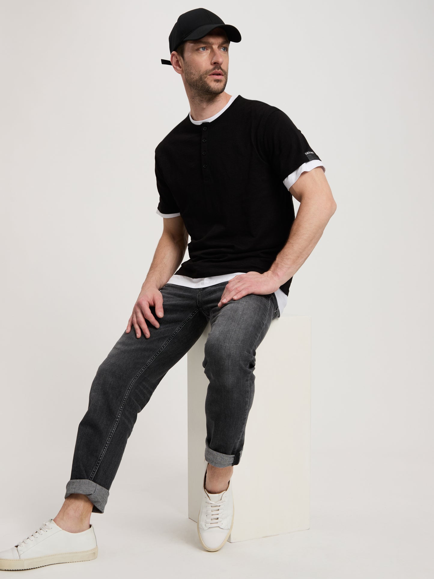 Men's regular T-shirt with short button placket, black.