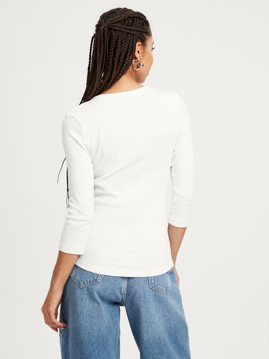 Women's slim long sleeve Henley style ecru.