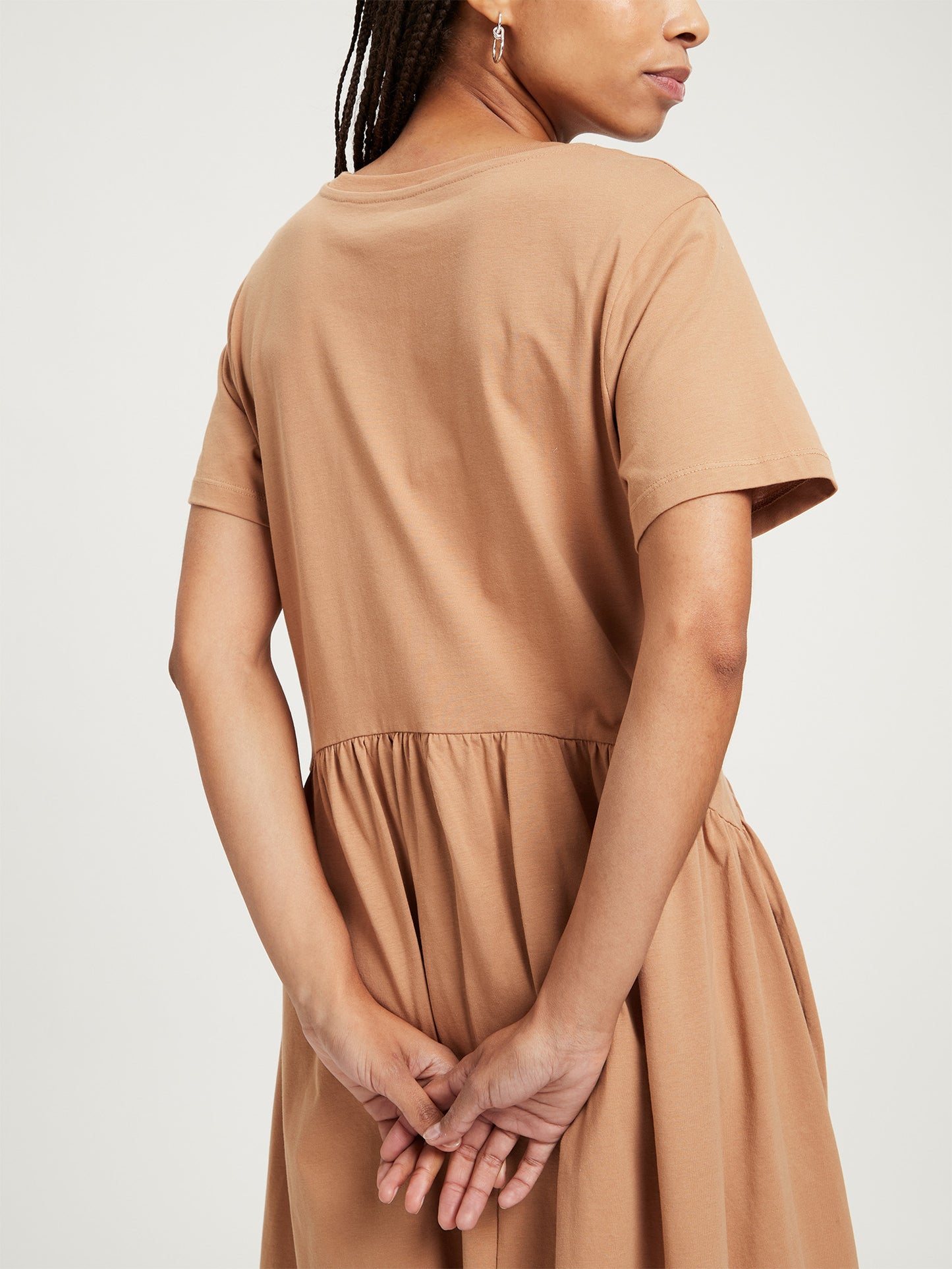 Women's relaxed jersey dress with pleated skirt, tobacco brown.